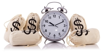 bags of money with alarm clock