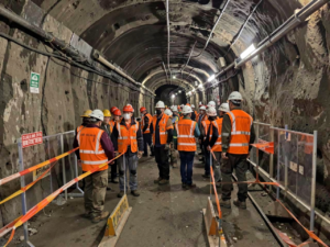 Mine workers wearing PPE in an underground mine prepared to respond to unforeseen hazards