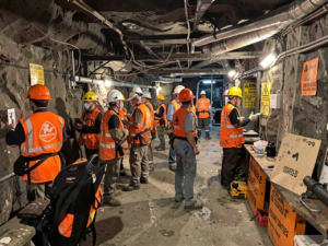 Mine workers wearing PPE in an underground mine preparing for MSHA inspections and safety audits