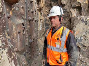 A miner in an underground mine participating in emergency response drills to improve safety and response time